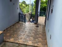 Casa Bairro Meridien com arvores frutíferas e espaço para  horta.